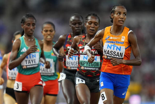 Sifan Hassan of the Netherlands is followed by Faith Kipyegon of Kenya in a Women's 5000-meters heat during the World Athletics Championships in Budapest, Hungary, on Aug. 23, 2023.