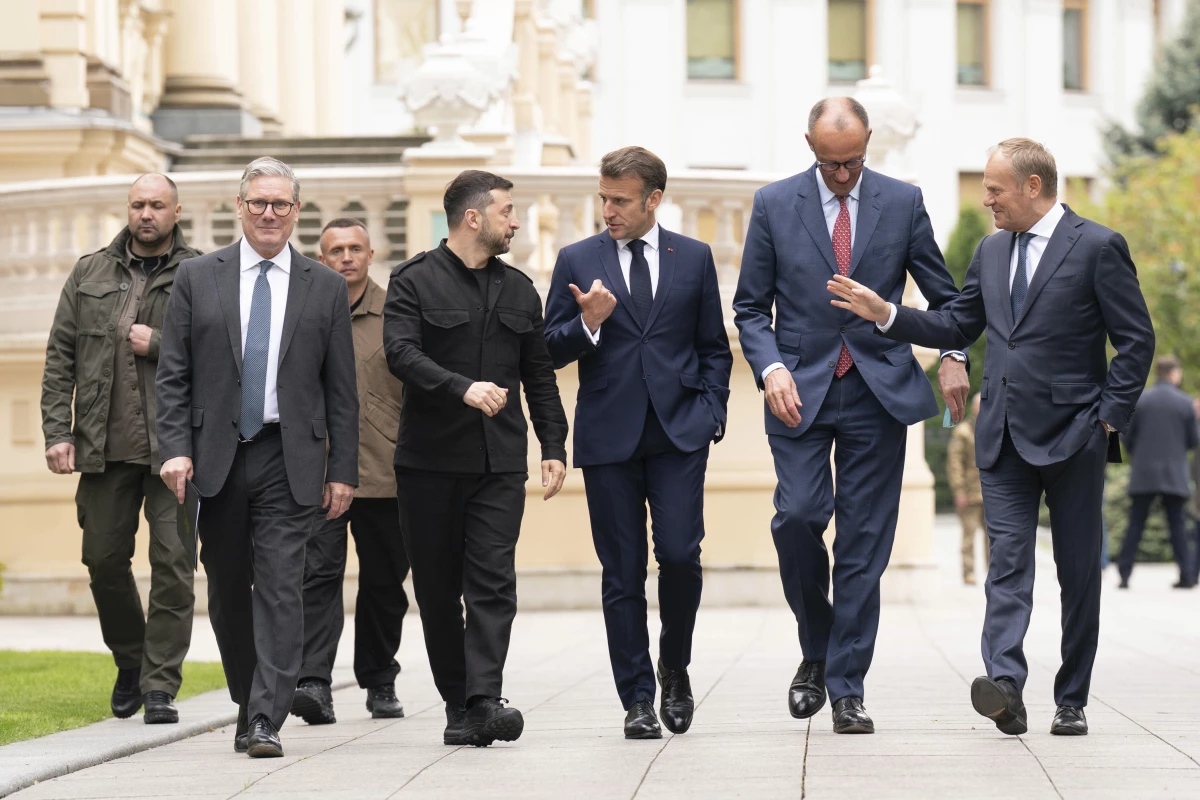 From second left, British Prime Minister Keir Starmer, Ukrainian President Volodymyr Zelenskyy, French President Emmanuel Macron, German Chancellor Friedrich Merz and Poland's Prime Minister Donald Tusk walk at the Presidential Palace in Kyiv, Ukraine, Saturday May 10, 2025.