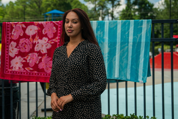 Deanna McKay says she has decided to sit out voting in the presidential race after watching last month's debate. McKay poses for a photo at the Wills Park Pool in Alpharetta, Ga.