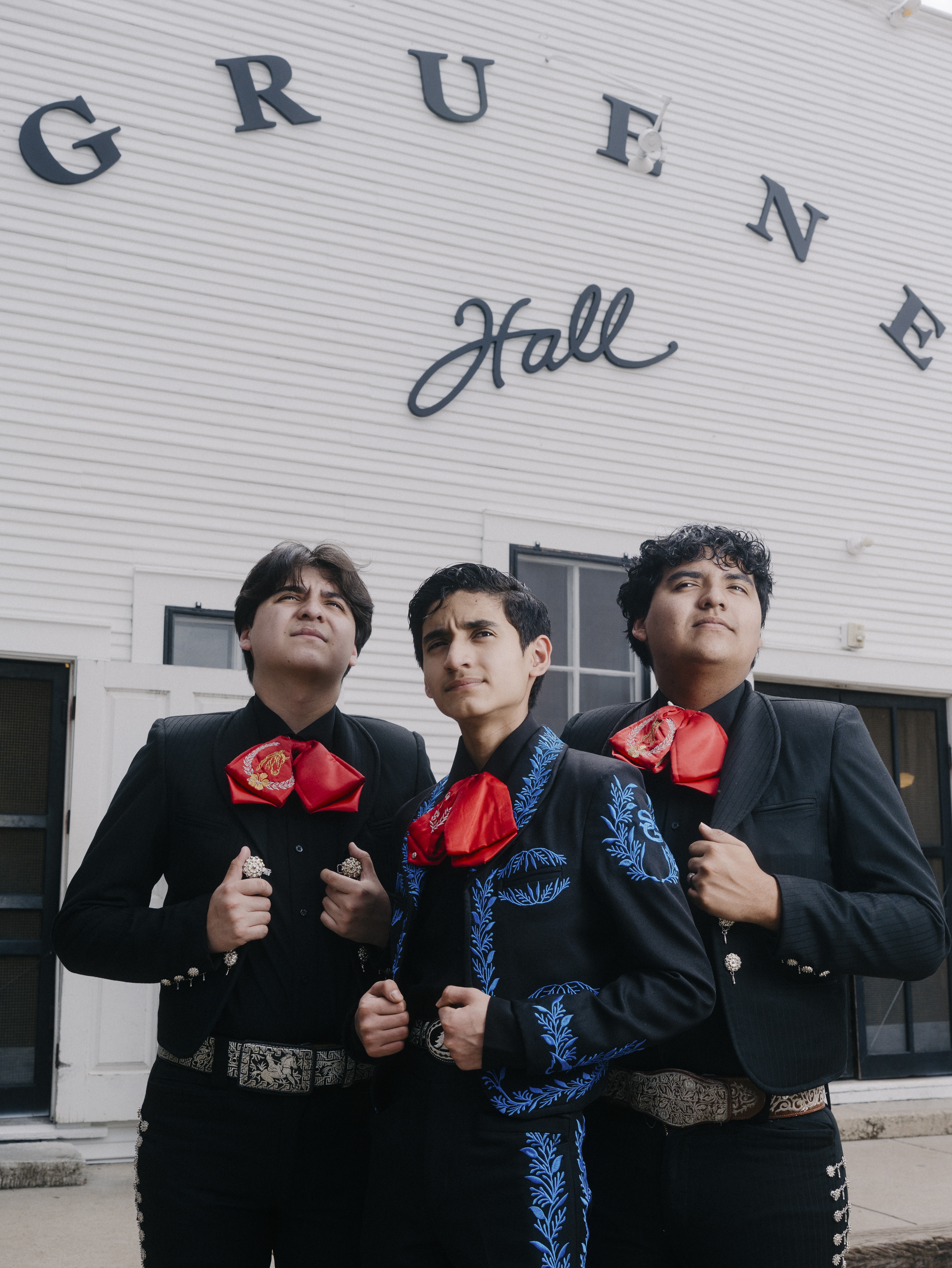 The Mariachi Brothers Antonio, Joshua, and Caleb Gámez-Cuéllar stand in front of Gruene Hall ahead of their performance as an opening act for country singer Kacey Musgraves in New Braunfels, Texas on May 4, 2026. The three brothers were recently detained by ICE along with their parents and held for 13 days at the detention center in Dilley, Texas.