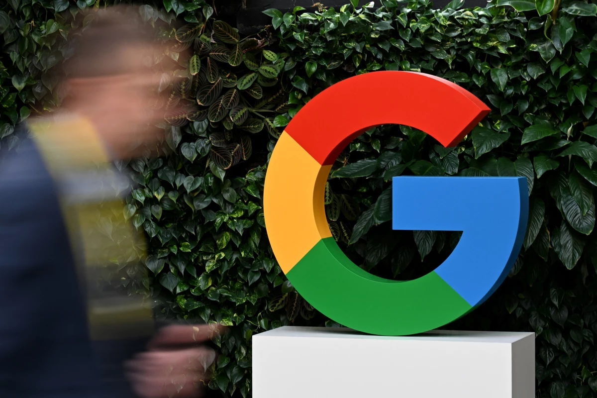 A man walks past a Google logo at the Google Campus in Warsaw on Feb. 13, 2025.