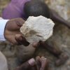 A man shows lithium stone from an illegal mining site in Paseli, north central Nigeria, on Nov. 5, 2024.