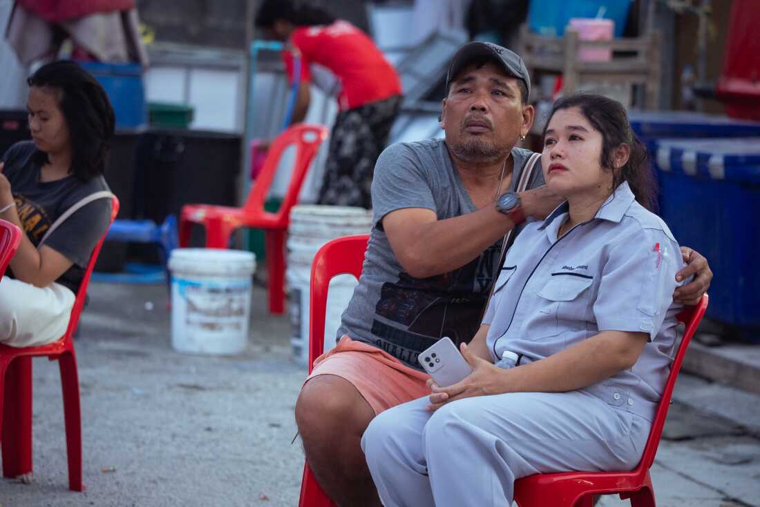 Members of the public anxiously wait for news on rescue operations at the Chatuchak skyscraper collapse site