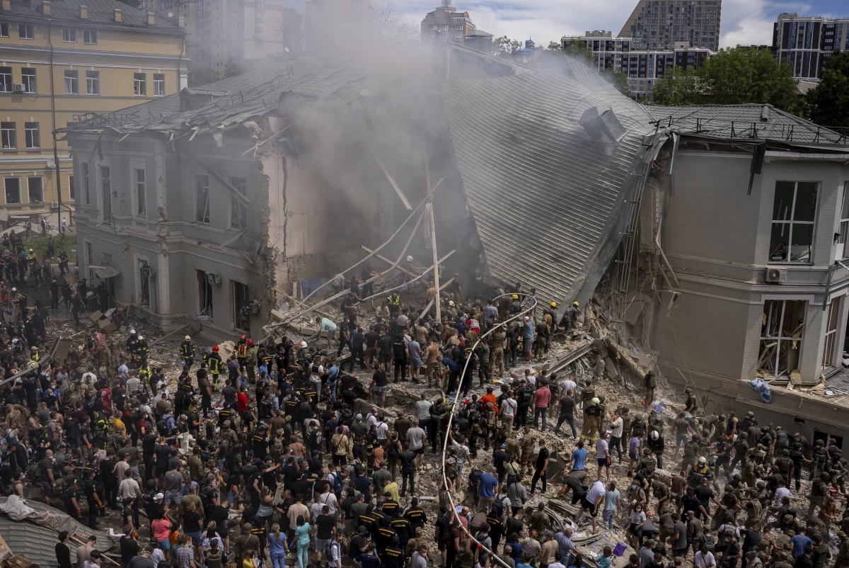 Emergency workers respond at the Okhmatdyt children's hospital hit by Russian missiles, in Kyiv, Ukraine, Monday.