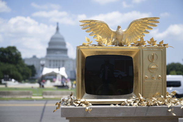A statue of a gilded TV playing clips of Trump dancing appeared on the National Mall for a few days in late June.