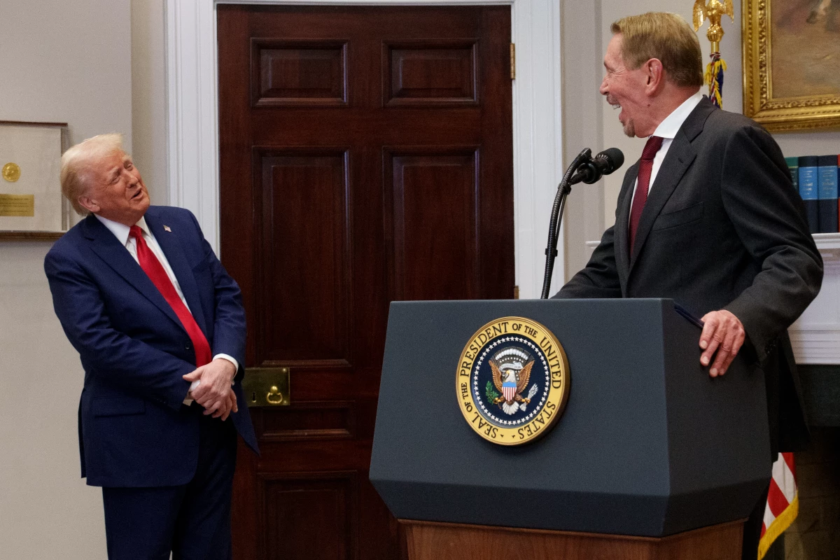 Oracle co-founder, CTO and Executive Chairman Larry Ellison and President Trump share a laugh as Ellison uses a stool to stand on as he speaks during a news conference about artificial intelligence investments in the White House on January 21, 2025.