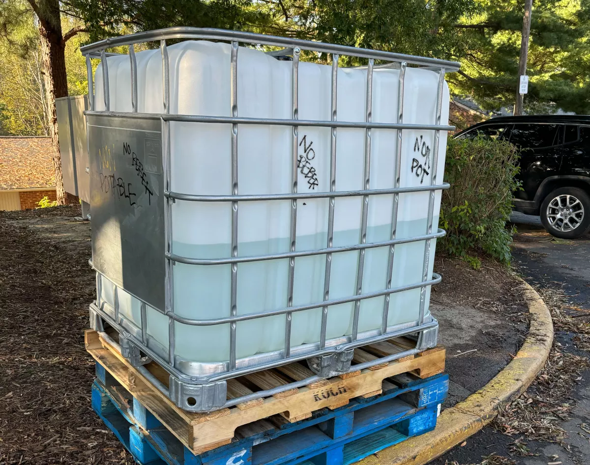 A large plastic containers that can hold at least 250 gallons of water to flush toilets.