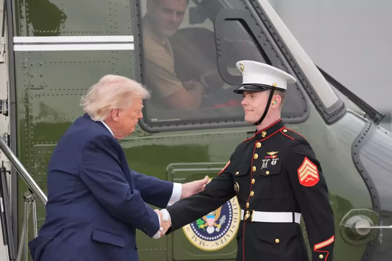 President Donald Trump shakes hands with a member of the U.S. Marine Corps as he arrives on Marine One to board Air Force One at Morristown Airport, Friday, May 22, 2026, in Morristown, N.J.