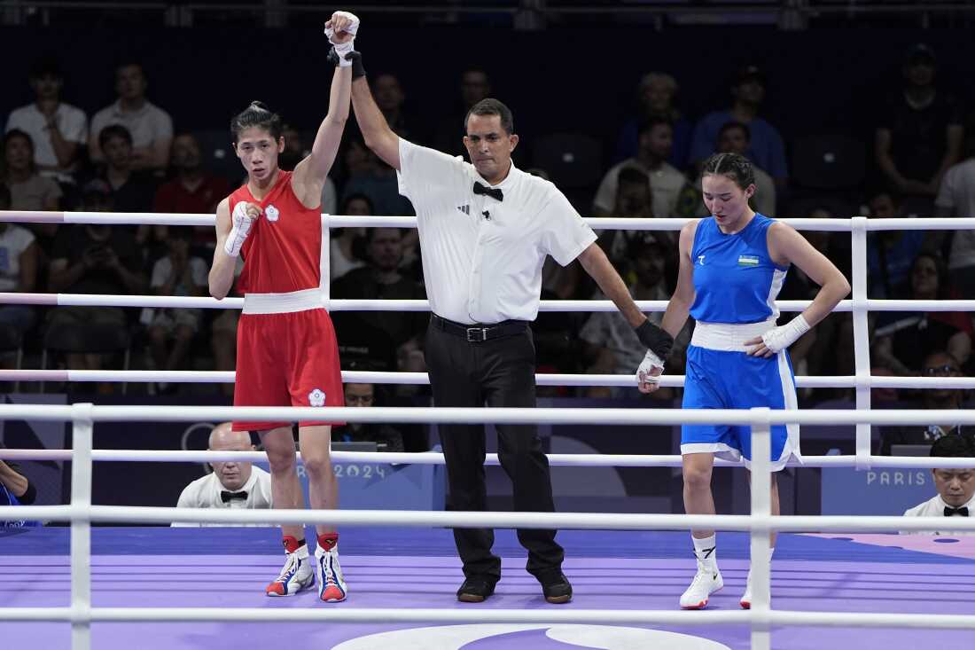 Taiwan's Lin Yu-ting, left, defeated Uzbekistan's Sitora Turdibekova in their women's 57 kg preliminary boxing match at the Olympics on Friday, in Paris.