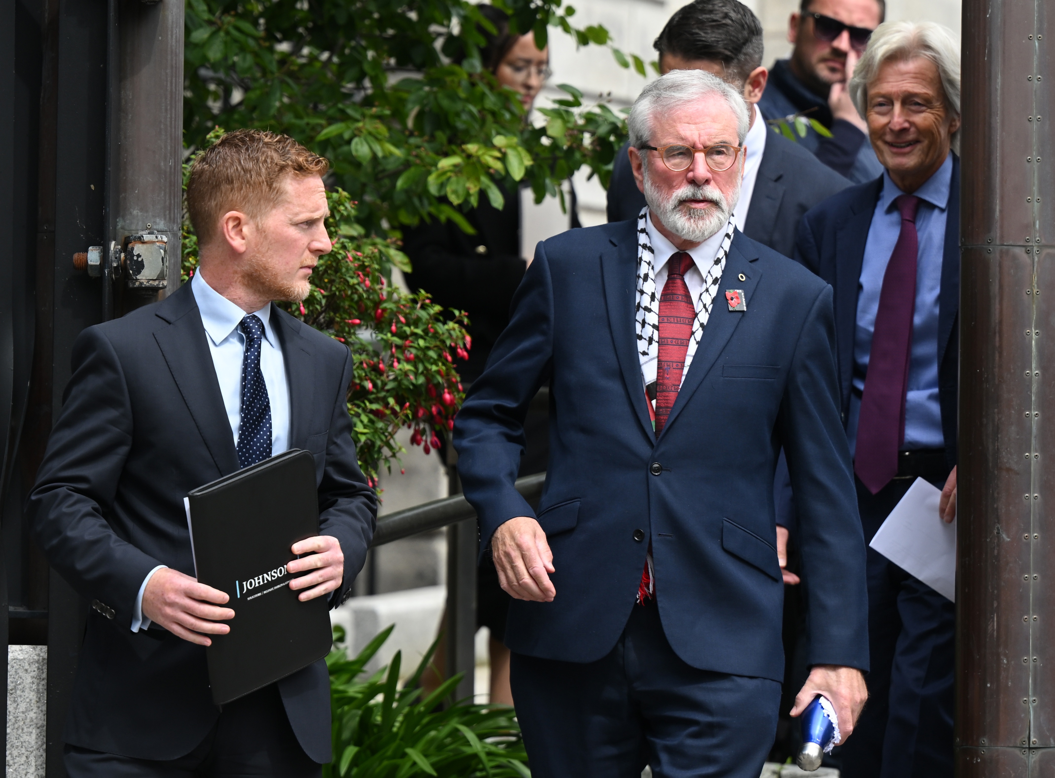Former Sinn Fein leader Gerry Adams leaves the court in Dublin on Friday after winning one of Ireland