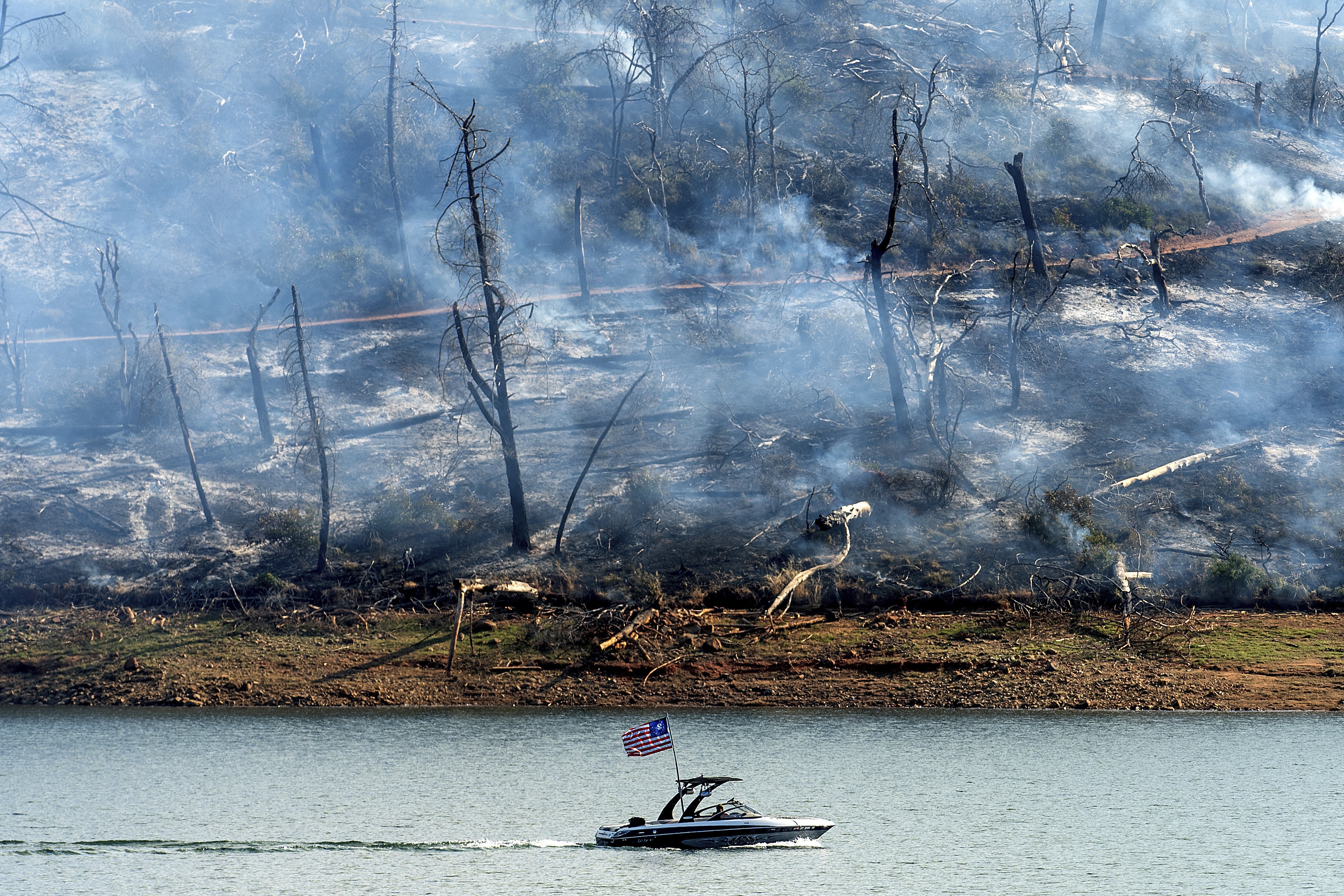 Thousands evacuate as Northern California wildfire spreads. More hot weather is expected