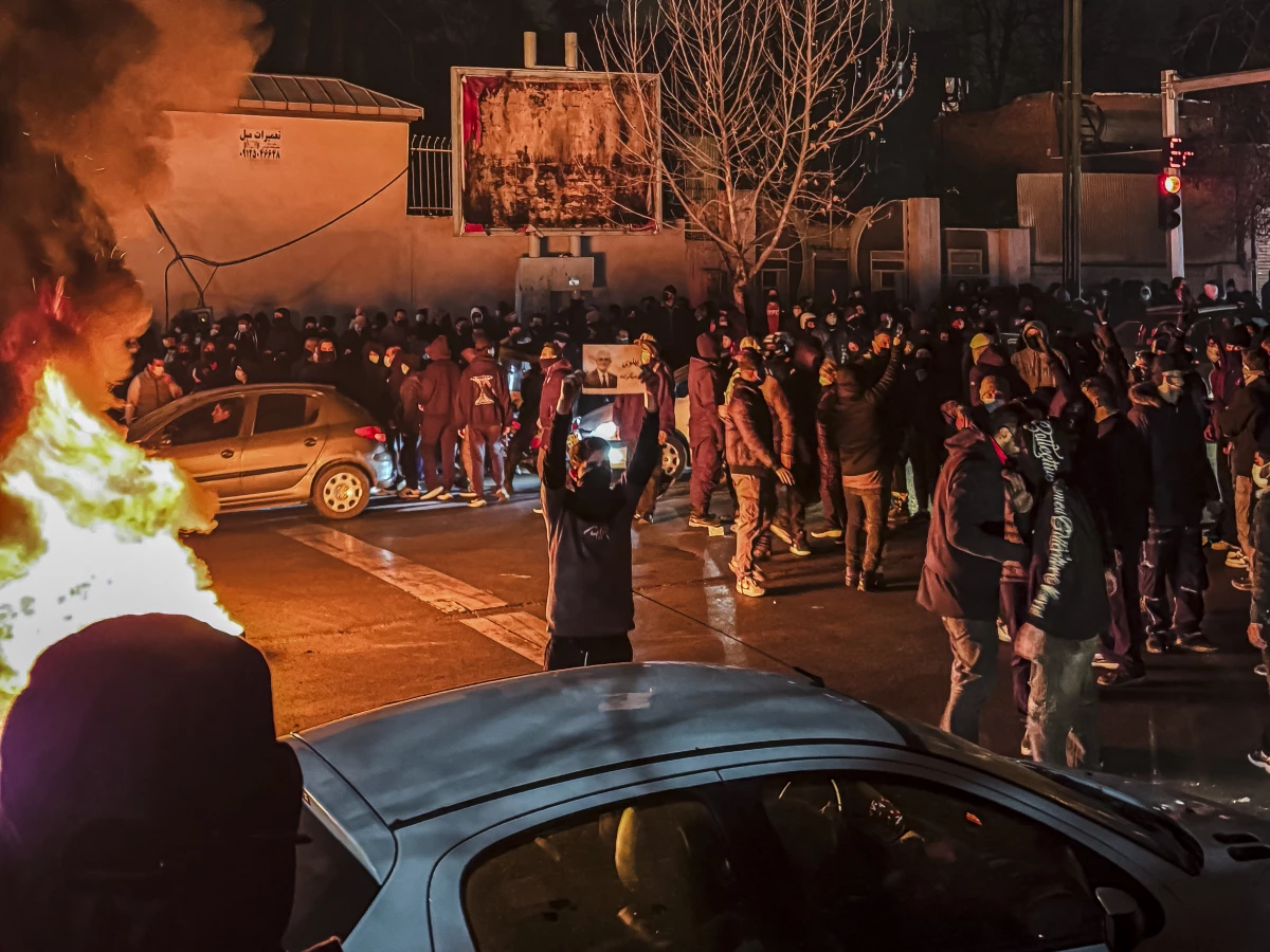 Iranians gather while blocking a street during a protest in Tehran, Iran on Jan. 9. The nationwide protests against failing government economic policies started in Tehran's Grand Bazaar in late December. The demonstrations spread to universities and other cities.