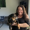 Marie Noon at her home in Brighton, Mich., with her dog, Ziggy. Despite being eligible for Medicaid, Noon was denied coverage in 2025 because of an error with the state’s benefits system. It took months of pushback before the state reversed its mistake. Even as a “tech-savvy” former bank manager, Noon says, she wanted to give up several times along the way.