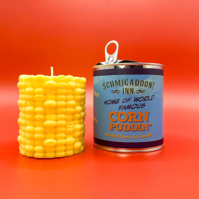 This "Corn Puddin'" candle is sold at Broadway's Schmigadoon!