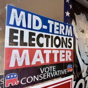 Signs reading "Midterm Elections Matter, Vote Conservative" and a photo of President Trump with the word Vote across the bottom seen on a Kansas GOP bus tour across the state to bolster Republican candidates in an unusually competitive year. 