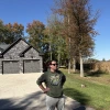 Nick Owens, an attorney in Brown County, Ohio, stands at the edge of a Mt. Orab neighborhood that abuts farmland that has been sold to a data center developer. Owens is leading an effort to halt the buildout of hyperscale data centers in communities like this one.