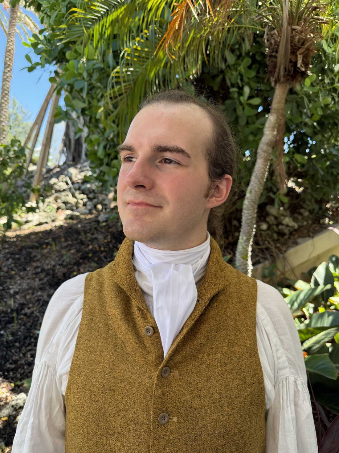 Seth Haskin in Naples, Fla., posing for his campaign on Sept. 3 in his typical outfit of a puff-sleeved linen shirt under an 18th century waistcoat, breeches fastened just below the knee and buckle shoes with long socks.
