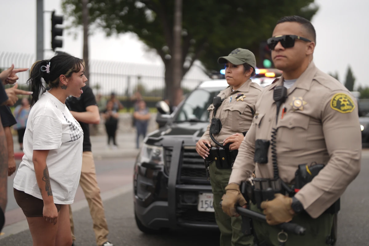 Protesters confront law enforcement agents outside an industrial park in Paramount, Calif., on Saturday, June 7.