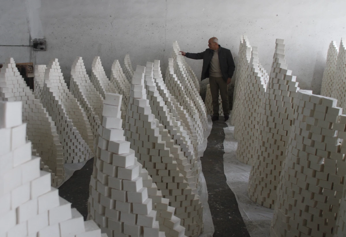 Ahmad Dwikat, a Palestinian worker, inspects bars of soap stacked to dry before packing them at a soap factory in the West Bank city of Nablus, on March 1.