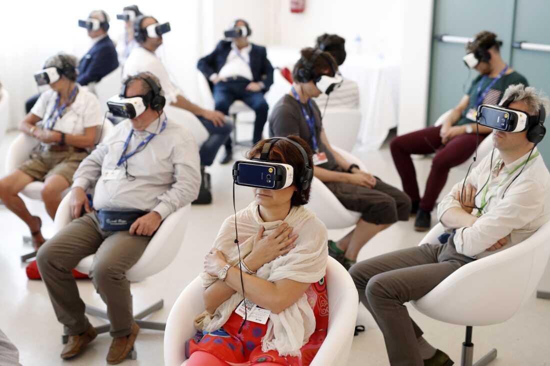 Visitors watch Jesus VR: The Story of Christ during the 73rd Venice Film Festival in 2016.