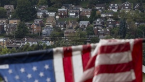 Houses across the Monongahela River are seen from Braddock, Pa., on Oct. 16, 2024.