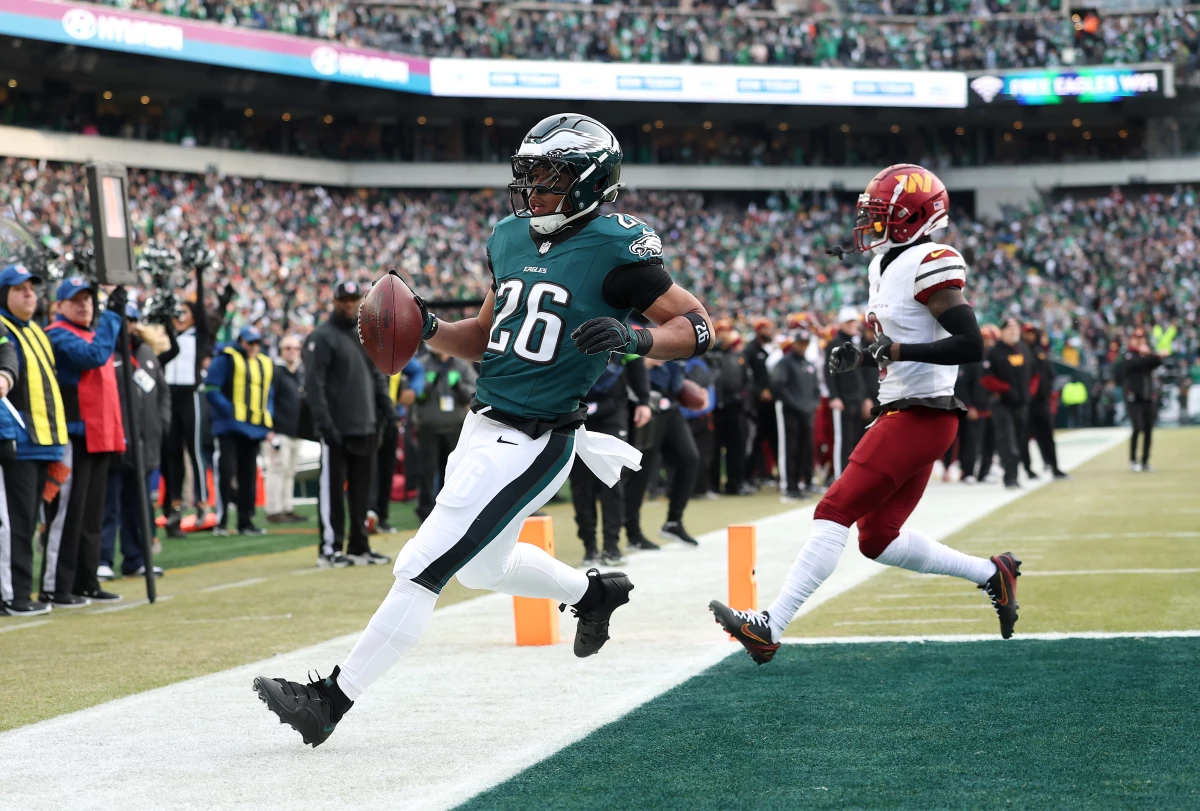 Saquon Barkley of the Philadelphia Eagles scores a 4-yard touchdown against the Washington Commanders during the first quarter in the NFC Championship Game at Lincoln Financial Field on Jan. 25 in Philadelphia, Pennsylvania.