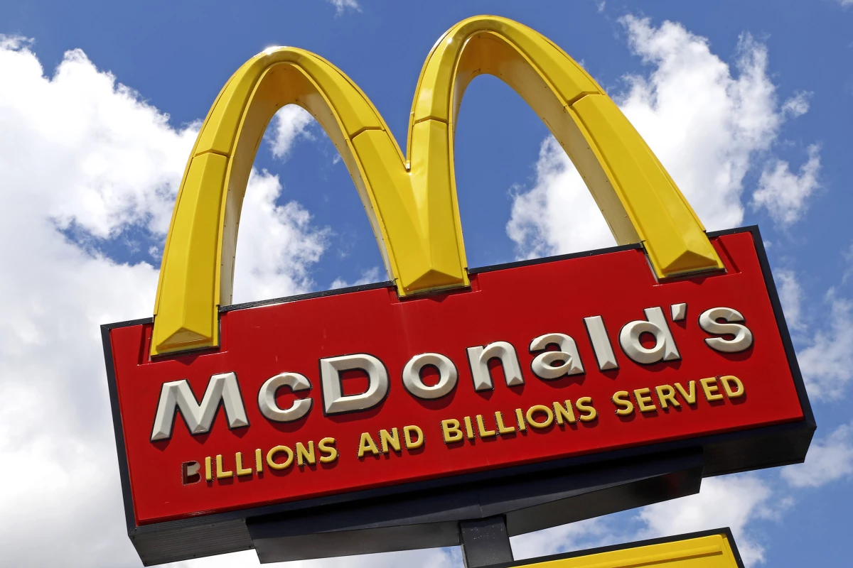 A sign outside a McDonald's restaurant is seen in Pittsburgh, on June 25, 2019. E. coli food poisoning linked to McDonald’s Quarter Pounder hamburgers has sickened at least 49 people in 10 states, including one person who died and 10 who were hospitalized.