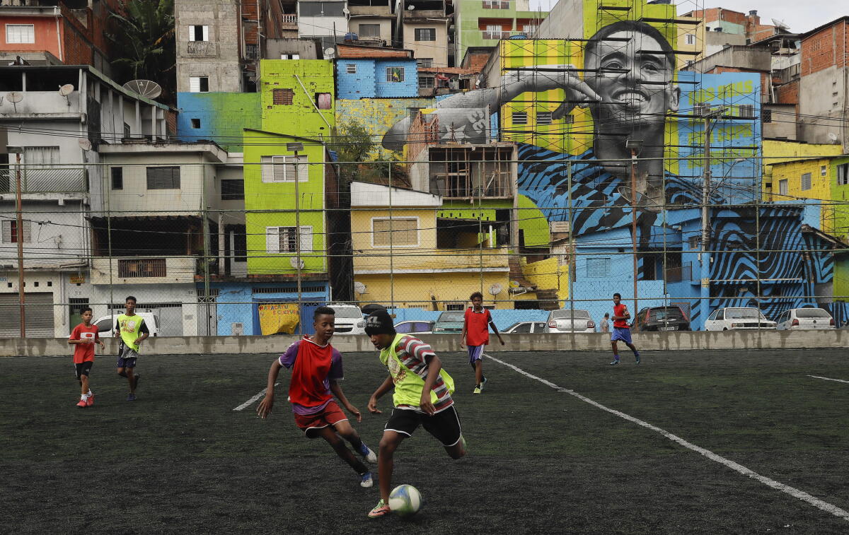 Kids playing a pickup soccer game in the Jardim Peri neighborhood of Sao Paulo, Brazil, in 2018.