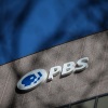 A sign for the Public Broadcasting Service is seen on its building headquarters on Feb. 18, 2025 in Arlington, Va.