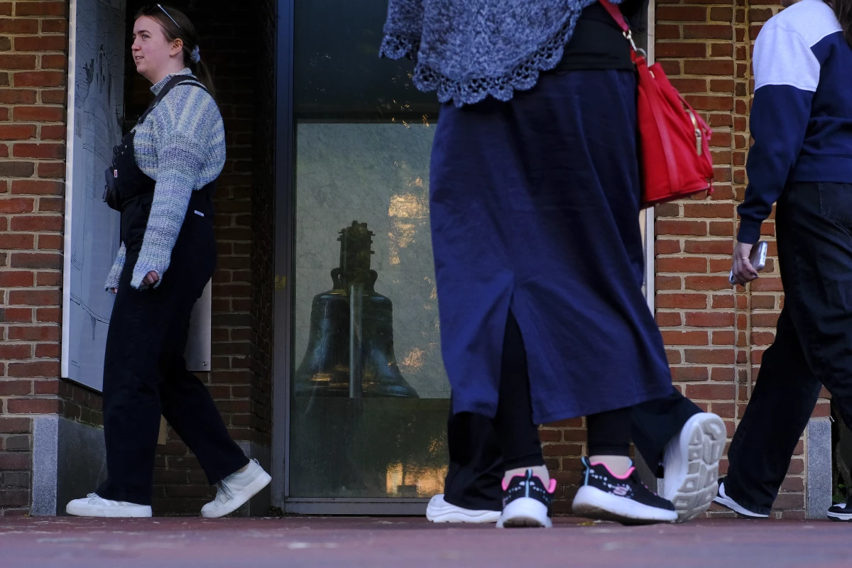 Visitors look at the Liberty Bell from outside the Liberty Bell Center because of the U.S. government shutdown in Philadelphia on Oct. 24.
