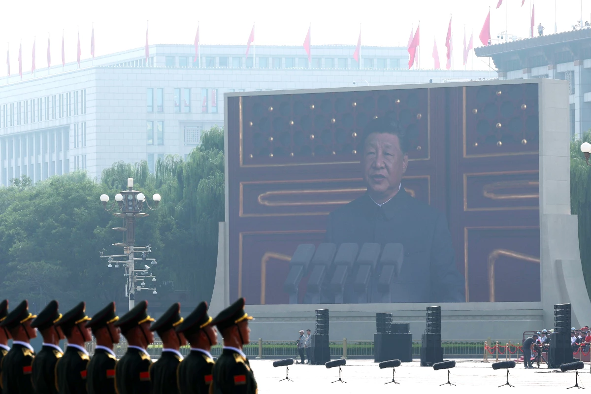 A display shows China's President Xi Jinping delivering a speech during a military parade marking the 80th anniversary of victory over Japan and the end of World War II, in Tiananmen Square on Sept. 3, 2025, in Beijing.