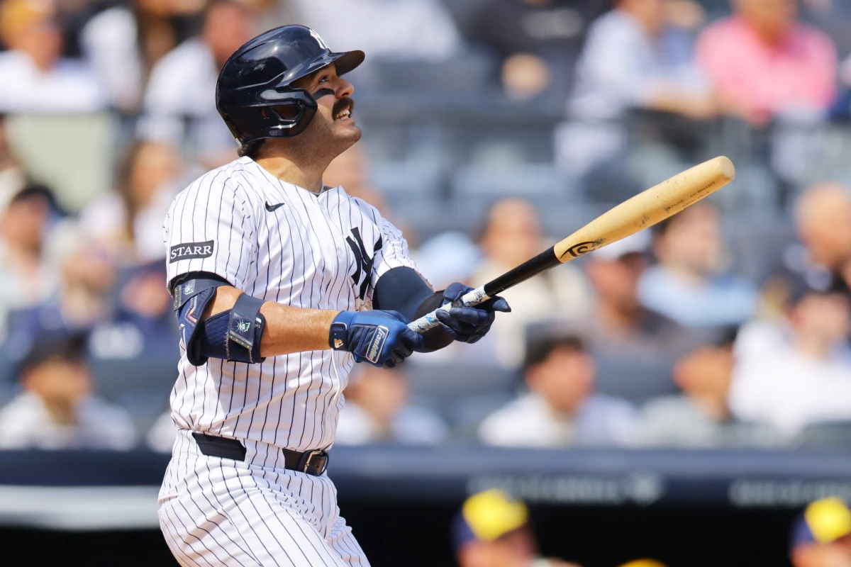 The New York Yankees' Austin Wells hits a home run using a torpedo bat against the Milwaukee Brewers at Yankee Stadium on Saturday. The bats' distinctive shape quickly became the talk of the new baseball season.
