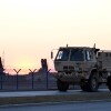 A military vehicle drives by Patriot air defense systems installed at the Rzeszow-Jasionka airport, a logistics hub for U.S. and European military aid to Ukraine, in southeastern Poland on March 6.