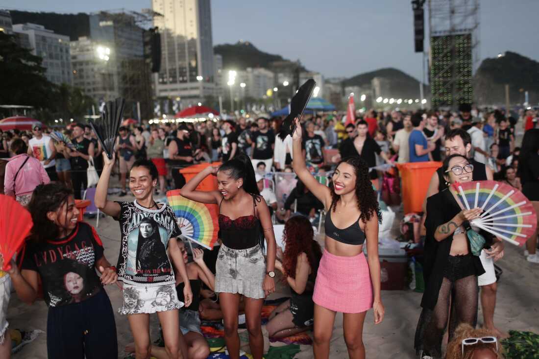Fans cheer as they wait for the start of Lady Gaga's free concert on Copacabana beach in Rio de Janeiro, Saturday, May 3, 2025.