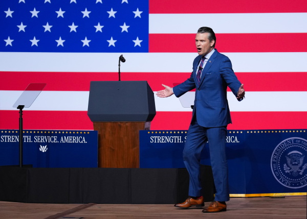Defense Secretary Pete Hegseth speaks to senior military leaders at Marine Corps Base Quantico on Sept. 30 in Quantico, Va. In an unprecedented gathering, almost 800 generals, admirals and their senior enlisted leaders have been ordered into one location from around the world on short notice.