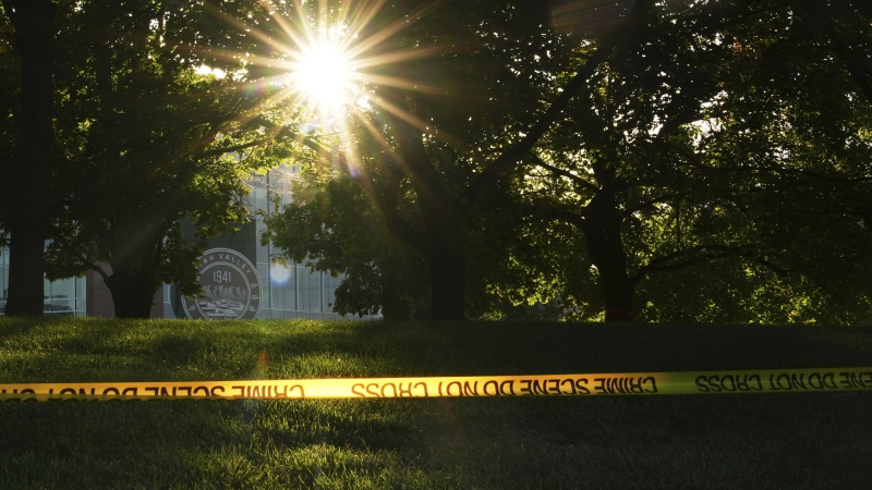Crime scene tape surrounds the perimeter of Utah Valley University after Turning Point USA CEO and co-founder Charlie Kirk was shot and killed , Saturday, Sept. 13, 2025, in Orem, Utah. Social media is promoting different views of why the shooter acted.