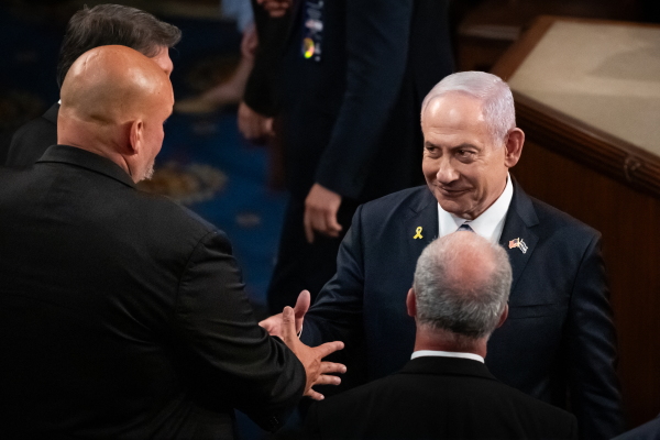 Israeli Prime Minister Benjamin Netanyahushakes hands with staunchly pro-Israel Sen, John Fetterman, D-Pa., after delivering an address to a joint session of Congress on July 24.