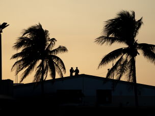 Members of the U.S. Secret Service stand by ahead of Trump's arrival at Palm Beach International Airport in February.