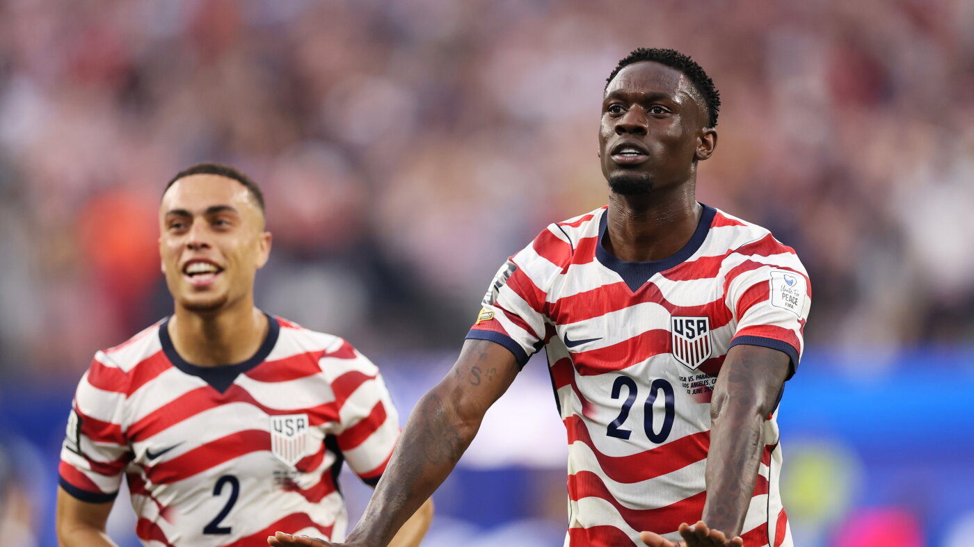 Folarin Balogun celebrates scoring for the United States during the World Cup Group D match against Paraguay