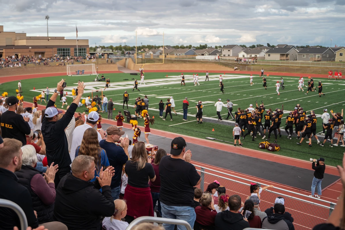 Harrisburg High School football fans cheer on the team in Harrisburg, S.D. South Dakota Public Broadcasting carries local high school games on air and online, but it has been hit hard after losing federal funding.