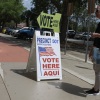 A sign directs voters to cast their ballots on April 1 at a polling station set up at the Flagler County Public Library in Palm Coast, Fla.