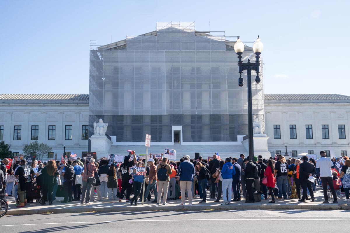 People gather  in support of minority voting rights outside the U.S. Supreme Court in Washington, D.C., on Wednesday.