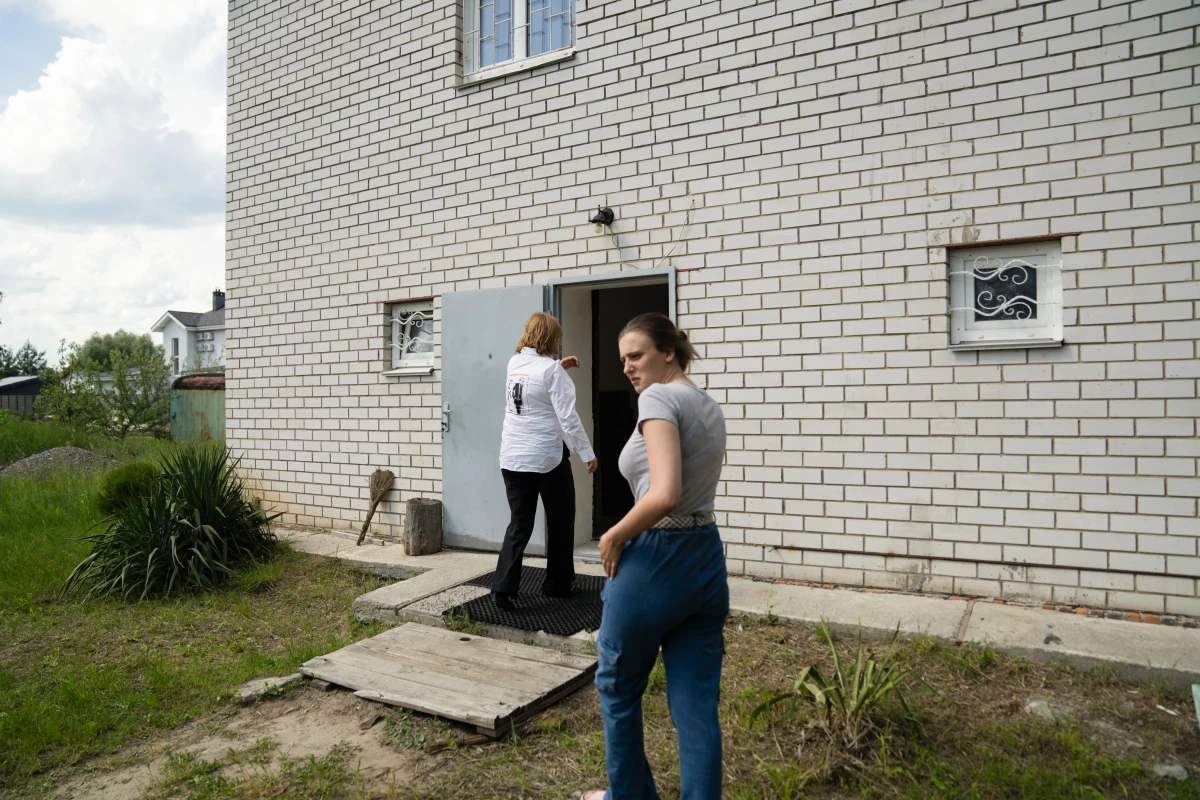 Kazakova follows her mother into the home where she's staying in a suburb outside Kyiv. She recently had back surgery and is recovering as she waits for her documents to go back to Prague, where she lives and also works for a logistics company.