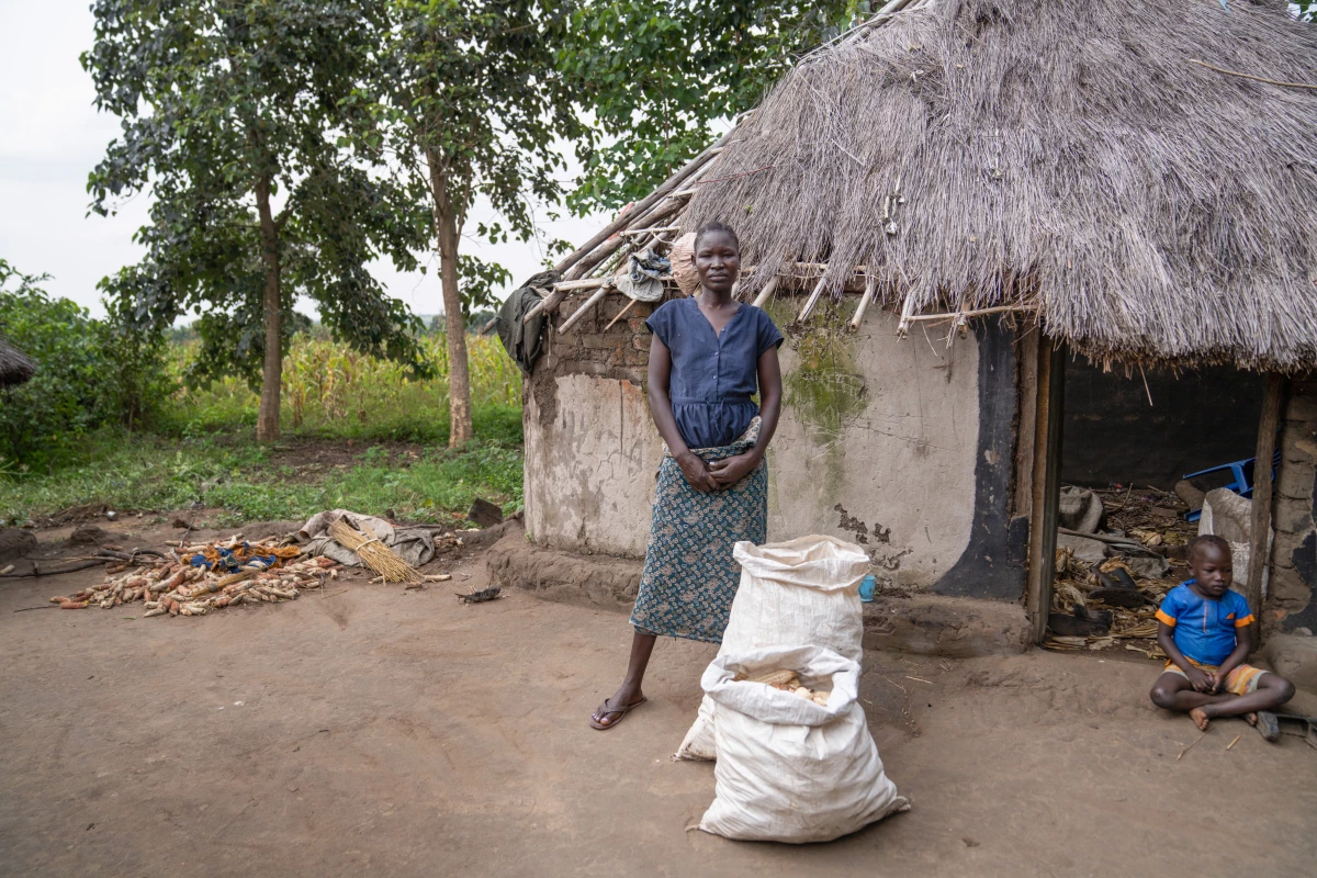 Santa Angwech shows the corn she has harvested from a local farm. She says it will last her family about 2 weeks. She and her family have been mostly depending on aid groups for food. Angwech saw the USAID-funded program to lift people out of poverty as her only way to self-sufficiency.