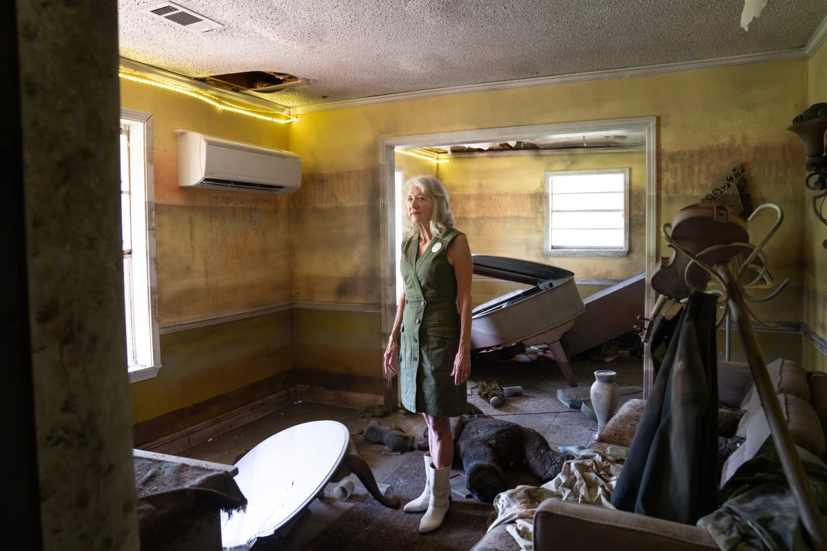 Sandy Rosenthal, founder of Levees.org, stands in the Flooded House Museum where one of the levees breached in New Orleans during Hurricane Katrina in 2005. The house was flooded, though the interior now is a recreation made by local artists.