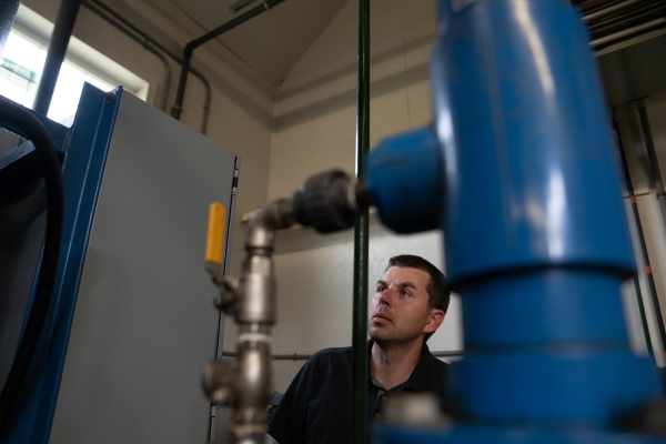 Chris Hughes, assistant water/wastewater operator for the towns of Cavendish and Proctorsville, Vt., deals with the effects of a power outage at the drinking water facility.