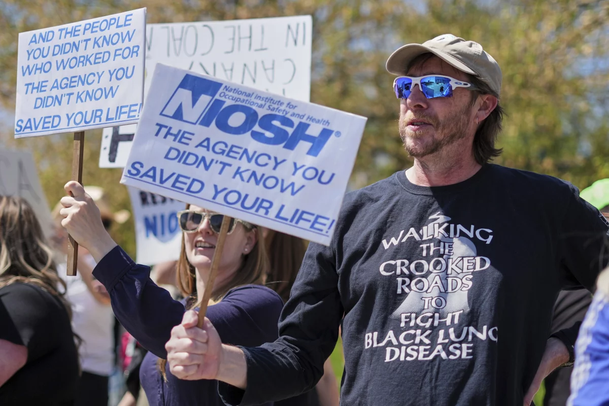 Supporters march outside a National Institute for Occupational Safety and Health facility in Morgantown, W.Va.