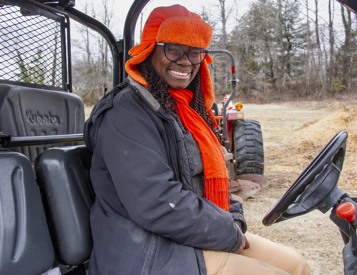 Farmer Gale Livingstone in a tractor at Deep Roots Farm in Upper Marlboro, Md.