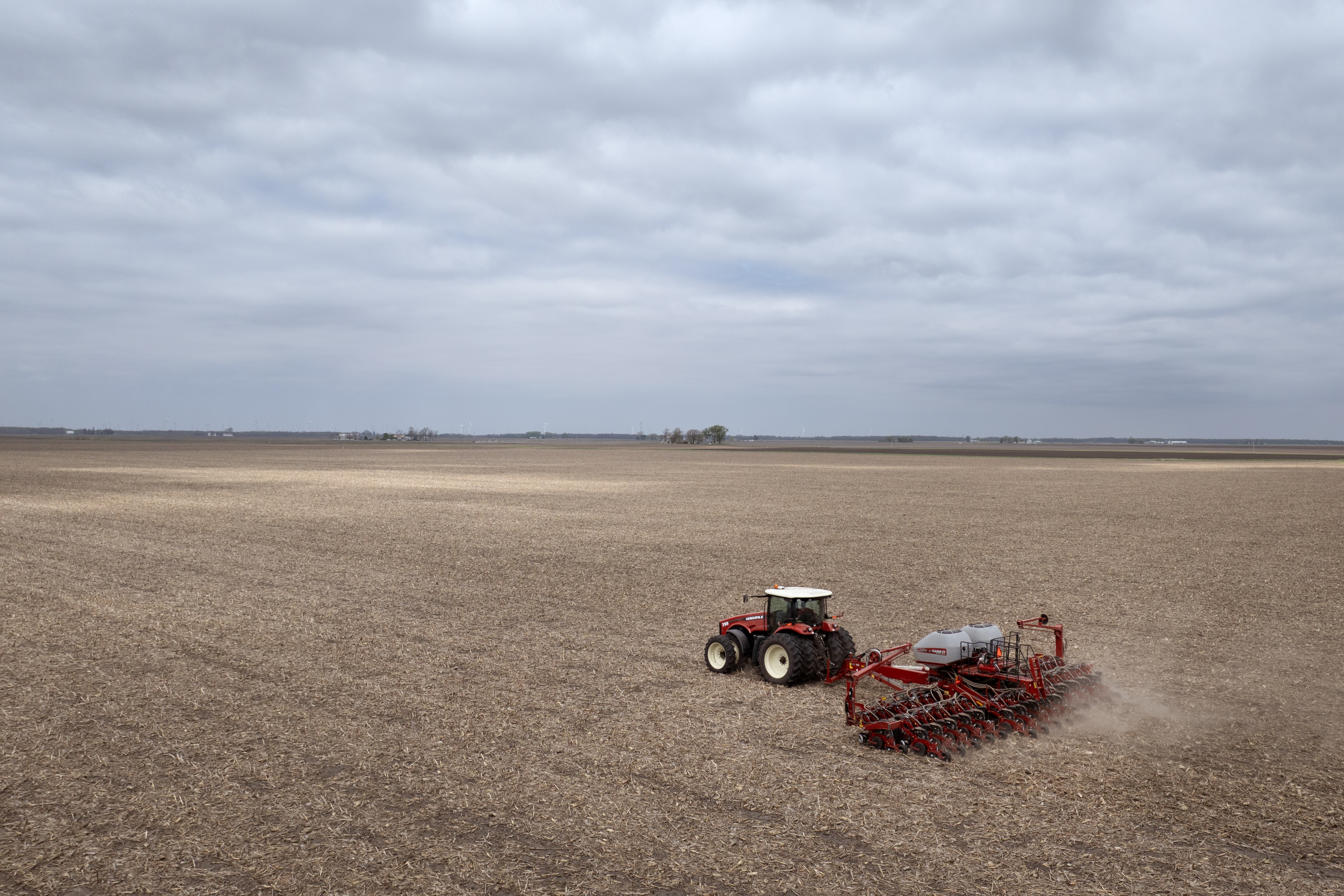 Dan Duffy uses a tractor to plant soybeans on land he farms with his brother on April 28, 2025 near Dwight, Illinois.