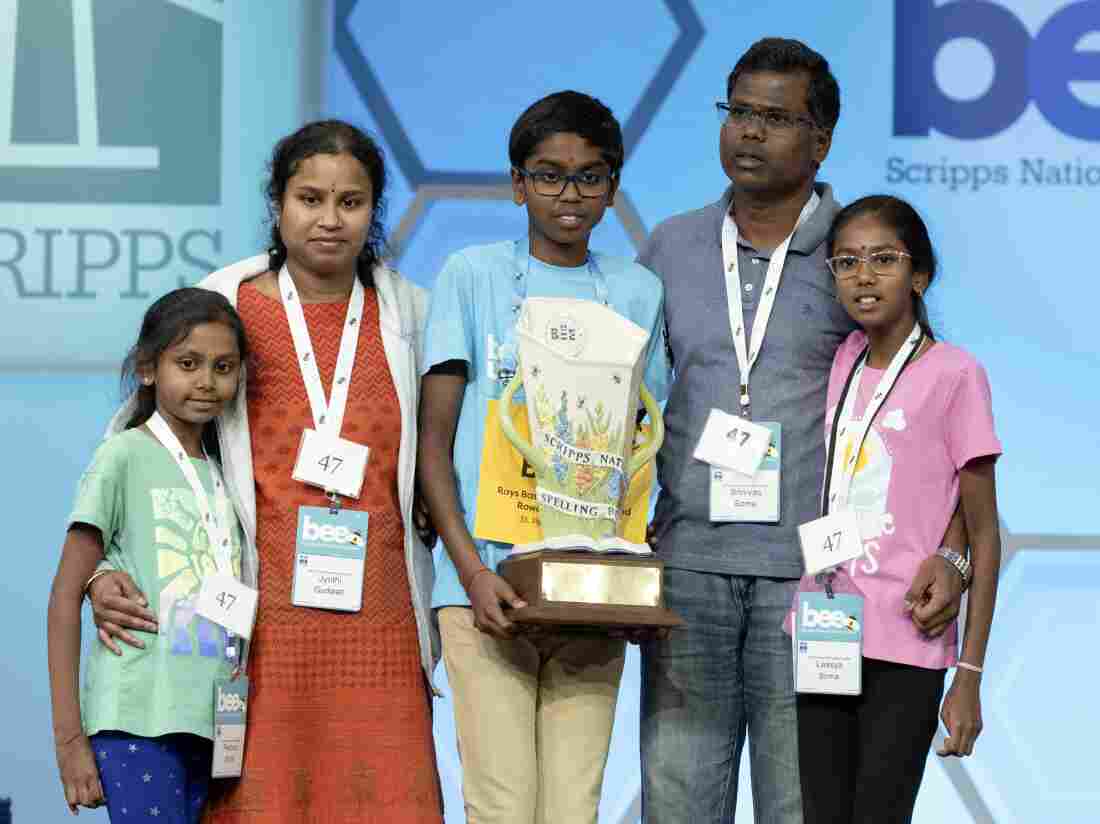 Bruhat Soma, 12, of Tampa, Fla., stands on stage with his family after winning the Scripps National Spelling Bee, in Oxon Hill, Md., Thursday, May 30, 2024.